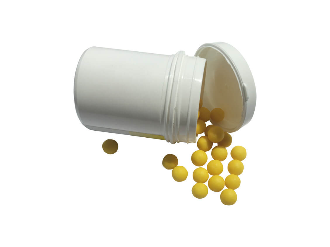 pills of adderall in a white small bottle container