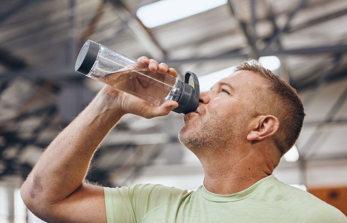 man who is a former addicted to Methadone is drinking a water as part of his detox
