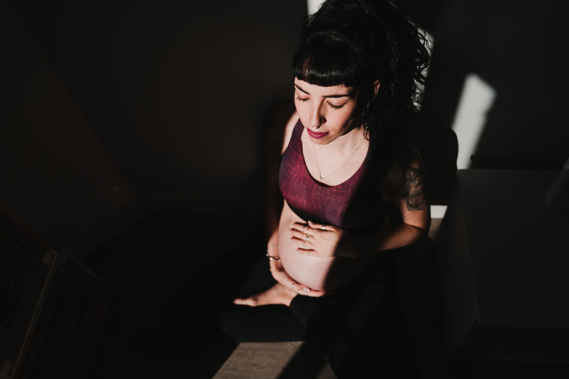 a tattooed pregnant woman with her ongoing detox