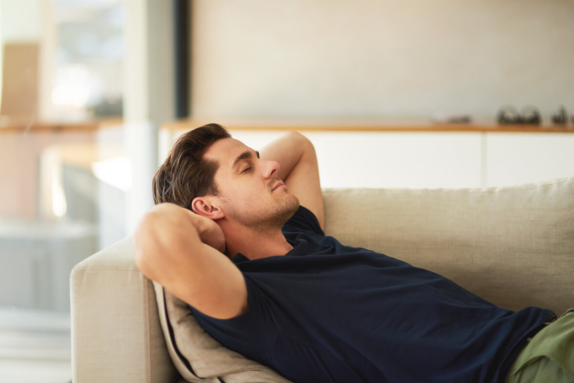 a man in a sofa durin an Ambulatory Detox treatment