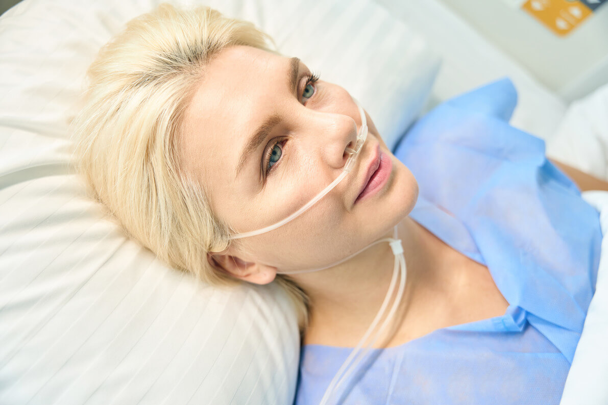 a woman being sedated via a general anesthesia as part of her rapid detox